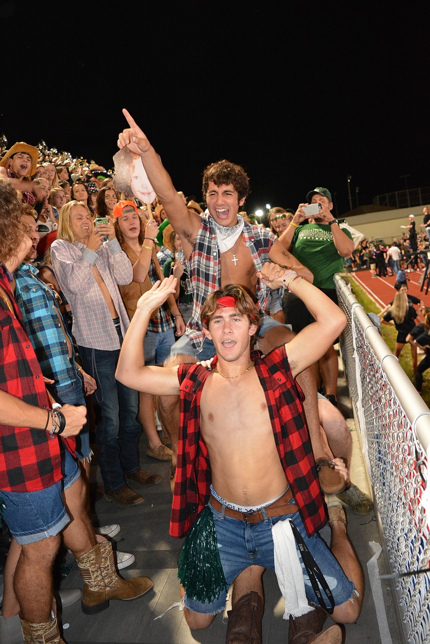 Zachary Weston, Christian Perez and Patrick Brown celebrate a touchdown.