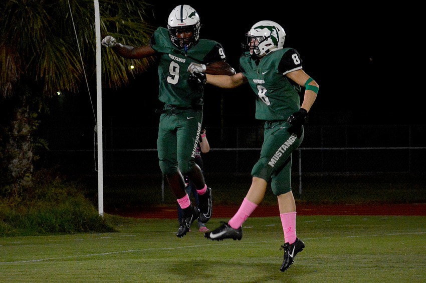Senior running back Troy Jefferson and junior wideout Chris Meegan celebrate a Jefferson score.