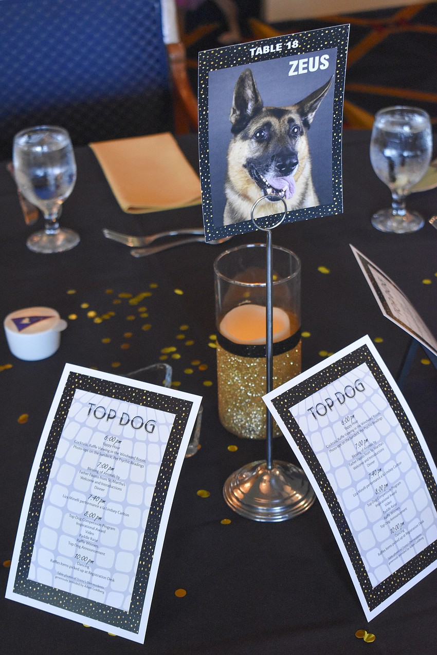 Each table honors a dog.