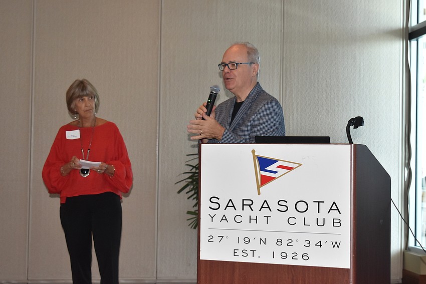 Becky VanderBogert watches Dale Anderson's presentation.