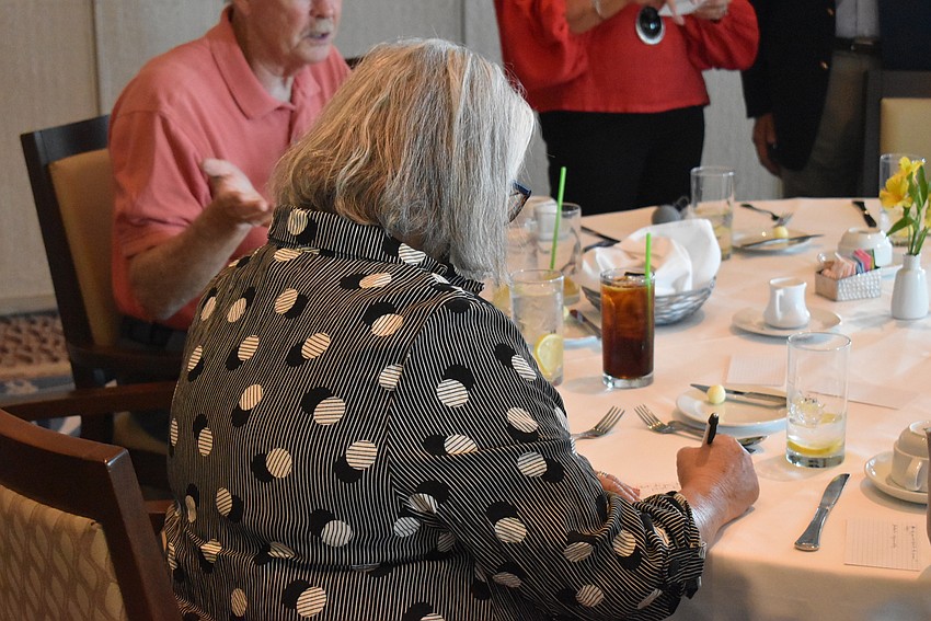 Lucie Lapovsky fills out a Q&A form for the session.