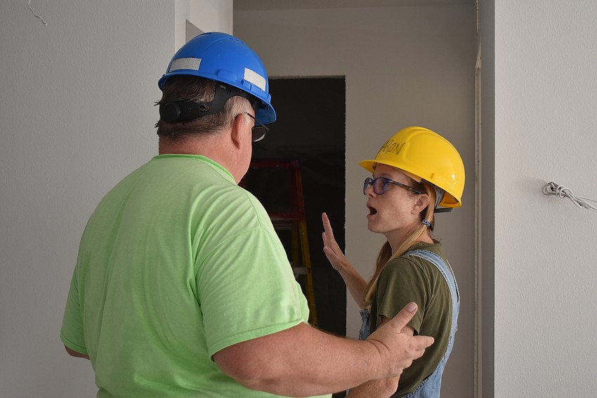 James McCann and Sharon Moran discuss where to paint.