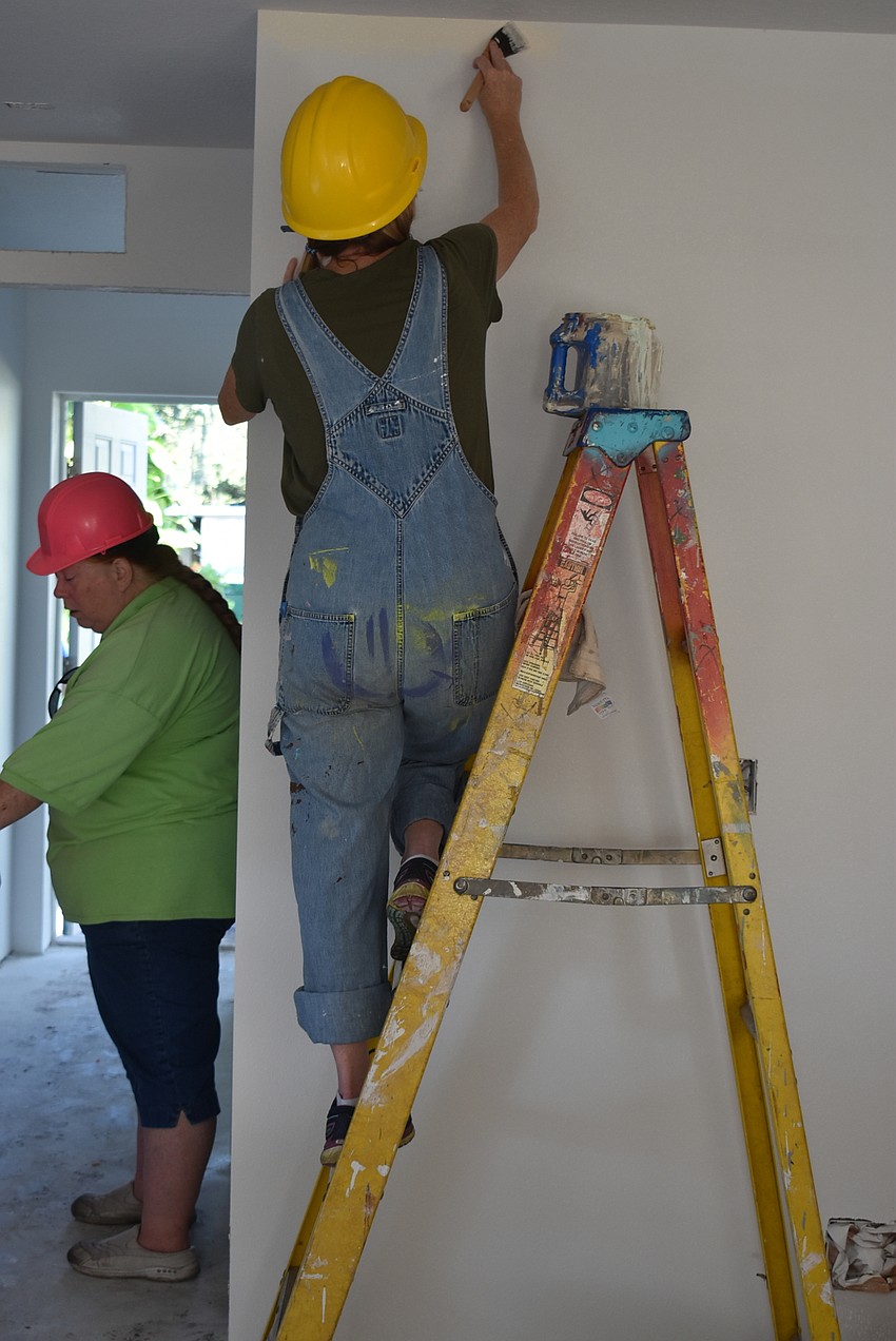 Barbara Slater and Sharon Moran focus on their tasks.