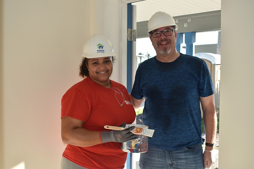 Future homeowner Robin Chacon and Pastor Kennth Blyth.