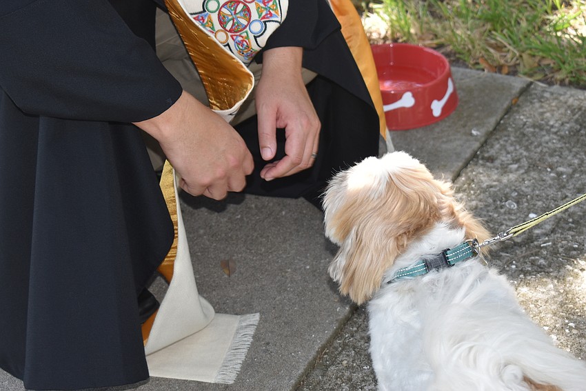 Father Dave Marshall blesses Buddy.