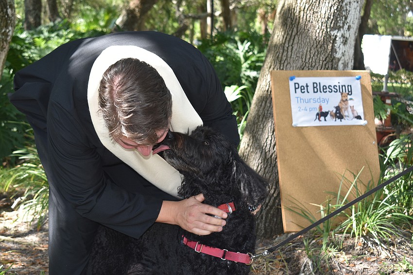 Reba thanks Father Dave Marshall in her own way.