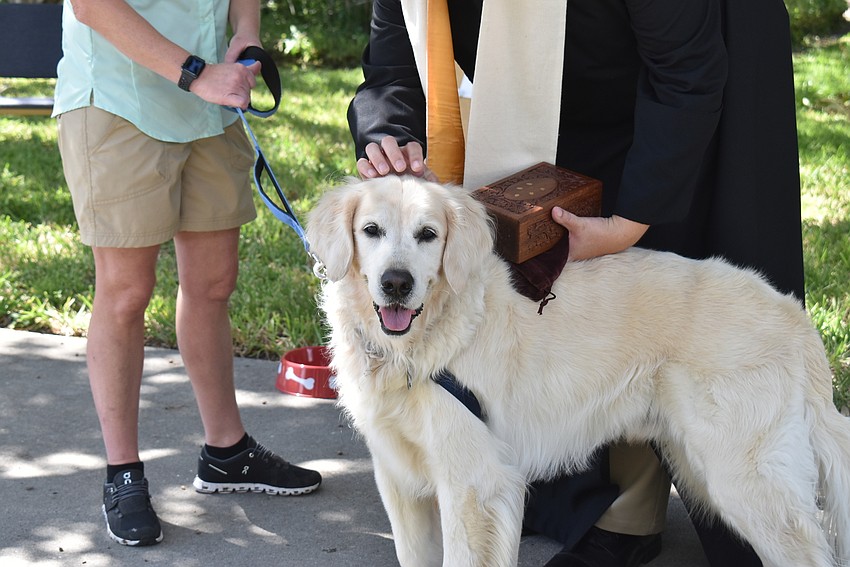 Sandi Drake brought Hunter and the ashes of Hunter's recently deceased brother to be blessed.