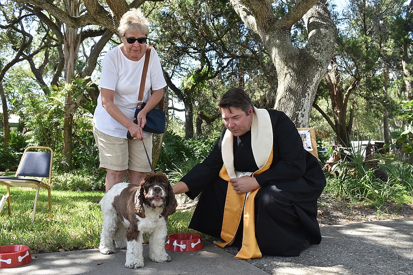 Gail Clay hangs onto Whitney as Father  Dave Marshall blesses her.