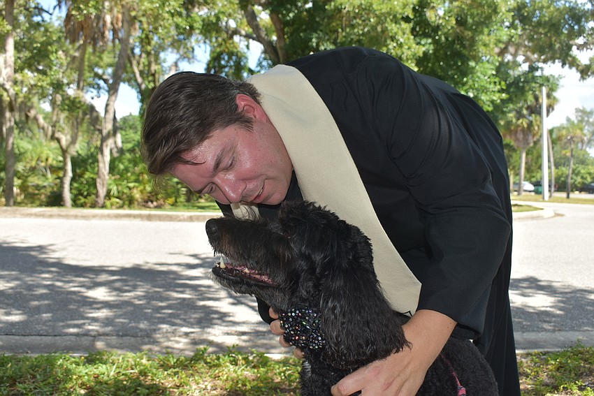 Reba and Father Dave Marshall.