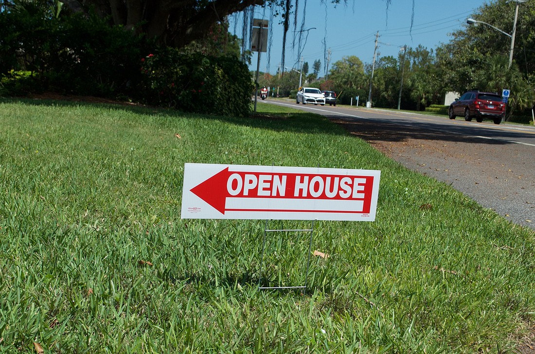 The town last year set up new rules governing how and where temporary signs, such as real estate signs noticing open houses, could be placed.