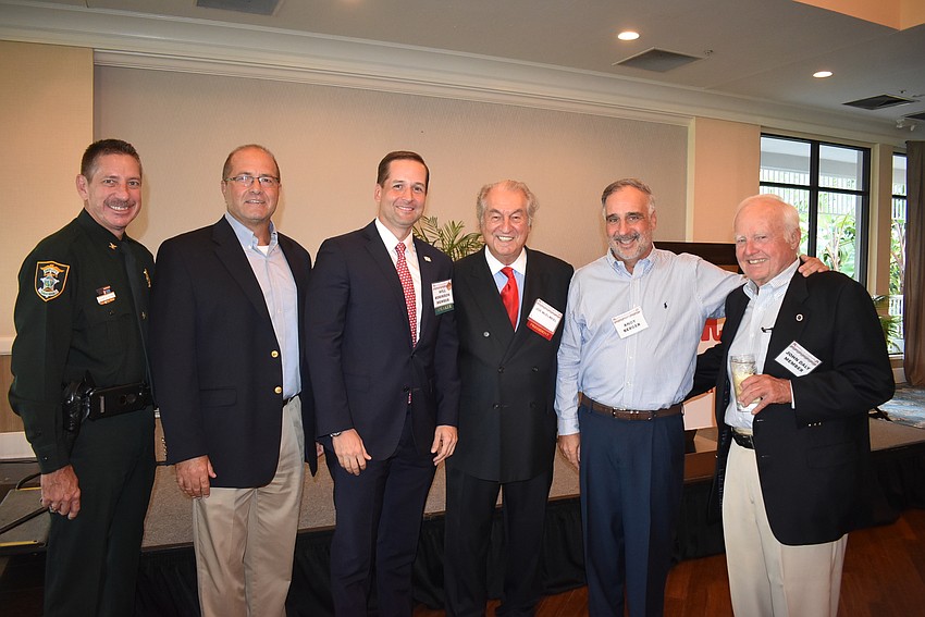 Col. Kurt Hoffman of the Sarasota County Sheriff's Office, Town Manager Tom Harmer, Florida Rep. Will Robinson, Joe McElmeel, Andy Berger and  Town Commissioner Jack Daly.