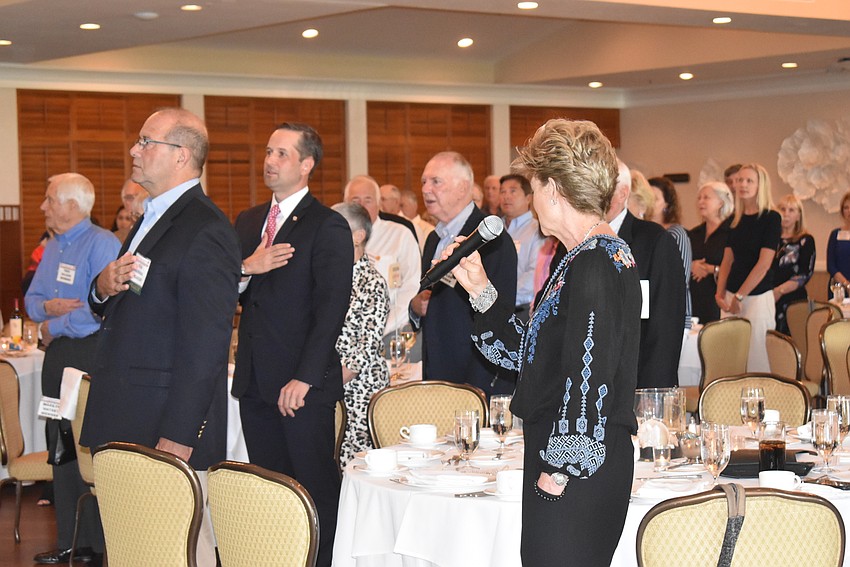Nancy McElmeel sang the National Anthem before the meeting started.