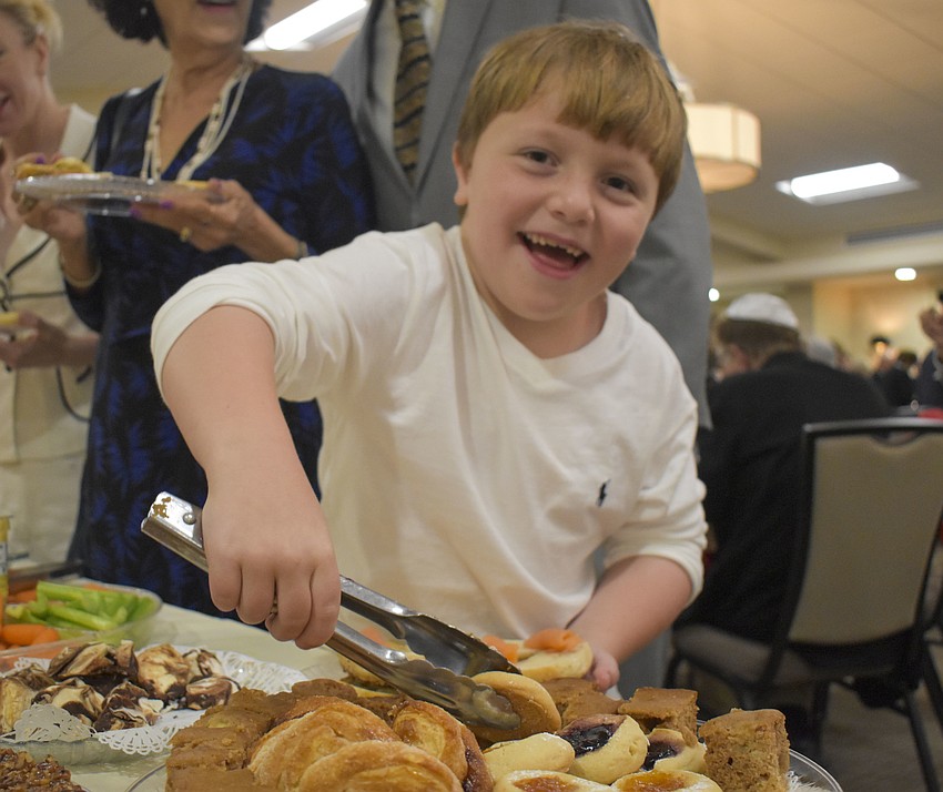 Benny Labinger, 7, picks a cookie from the platter.