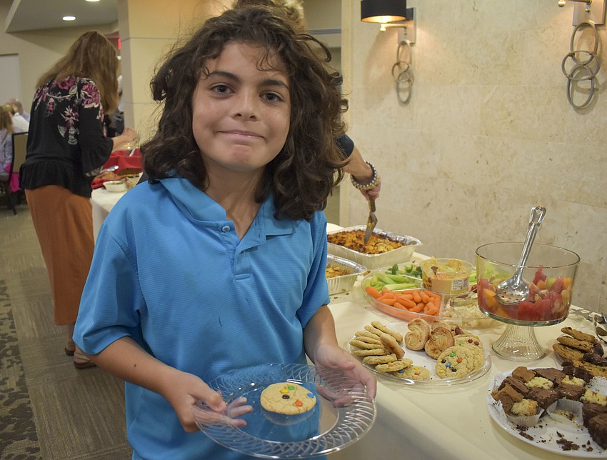 Mark Lowell, 9, picks an M&M cookie.