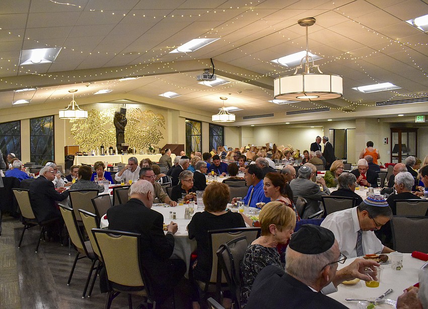 The Temple Emanu-el congregation break their fast together.