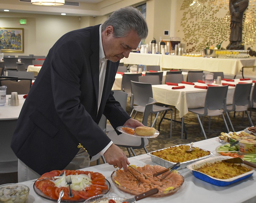 Ernie Freedman breaks his fast with smoked salmon.