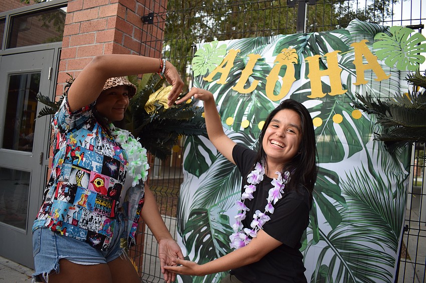 Seniors Kiya Resner and Alea Monson take a photo to commemorate their final homecoming bonfire.
