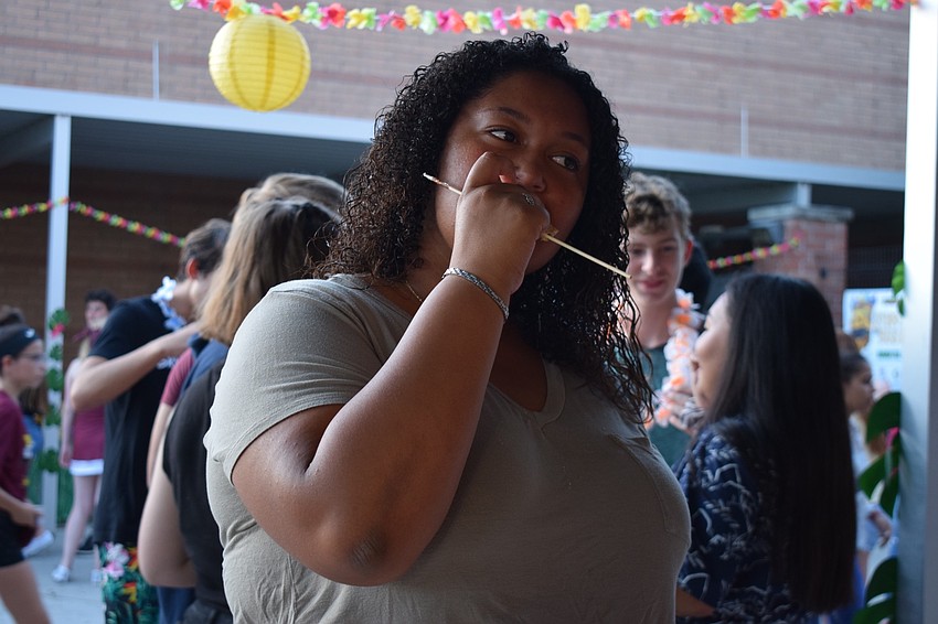 Senior Jasmin Mendoza enjoys a s'more during the bonfire. She said she was excited for the big dance circle at the end of the night.