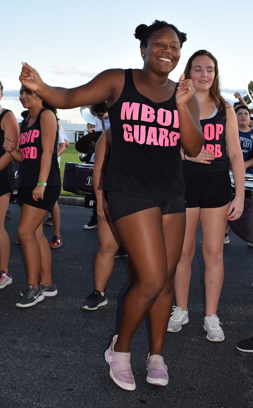 Marching Band of Pirates color guard member and sophomore Ashauntay Floyd dances to the drumline's cadence. Floyd said she loves performing and being able to show school spirit.
