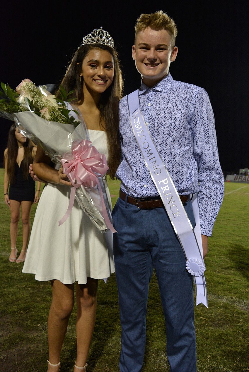 Freshman homecoming princess Maya Dreyfus and prince Benny Hedgepeth are all smiles.