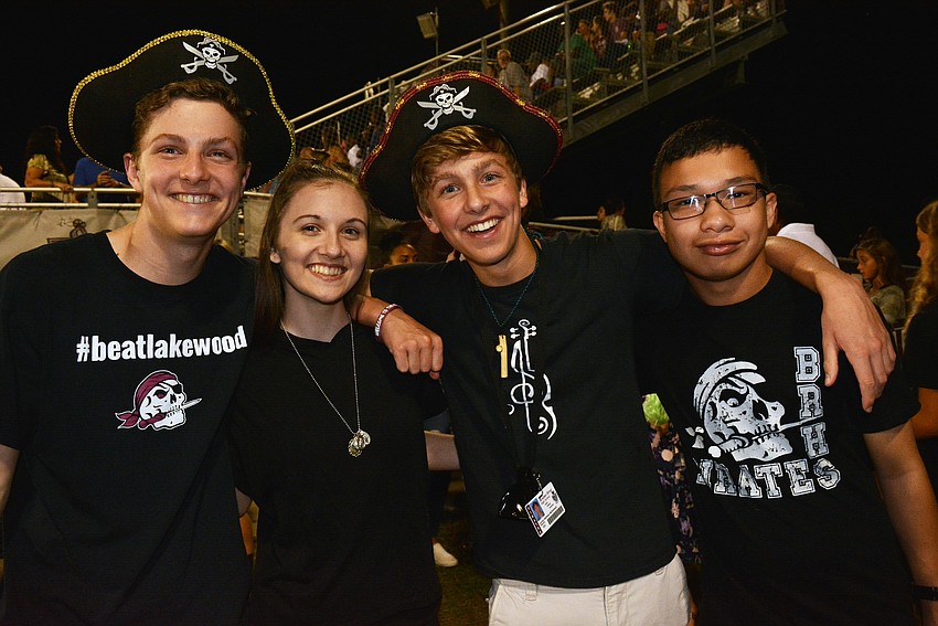 Braden River's Gabriel McDerment, visitor Isabella Henry, and fellow Pirates Curran McDerment and Joel Olvera show their pirate spirit with hats.