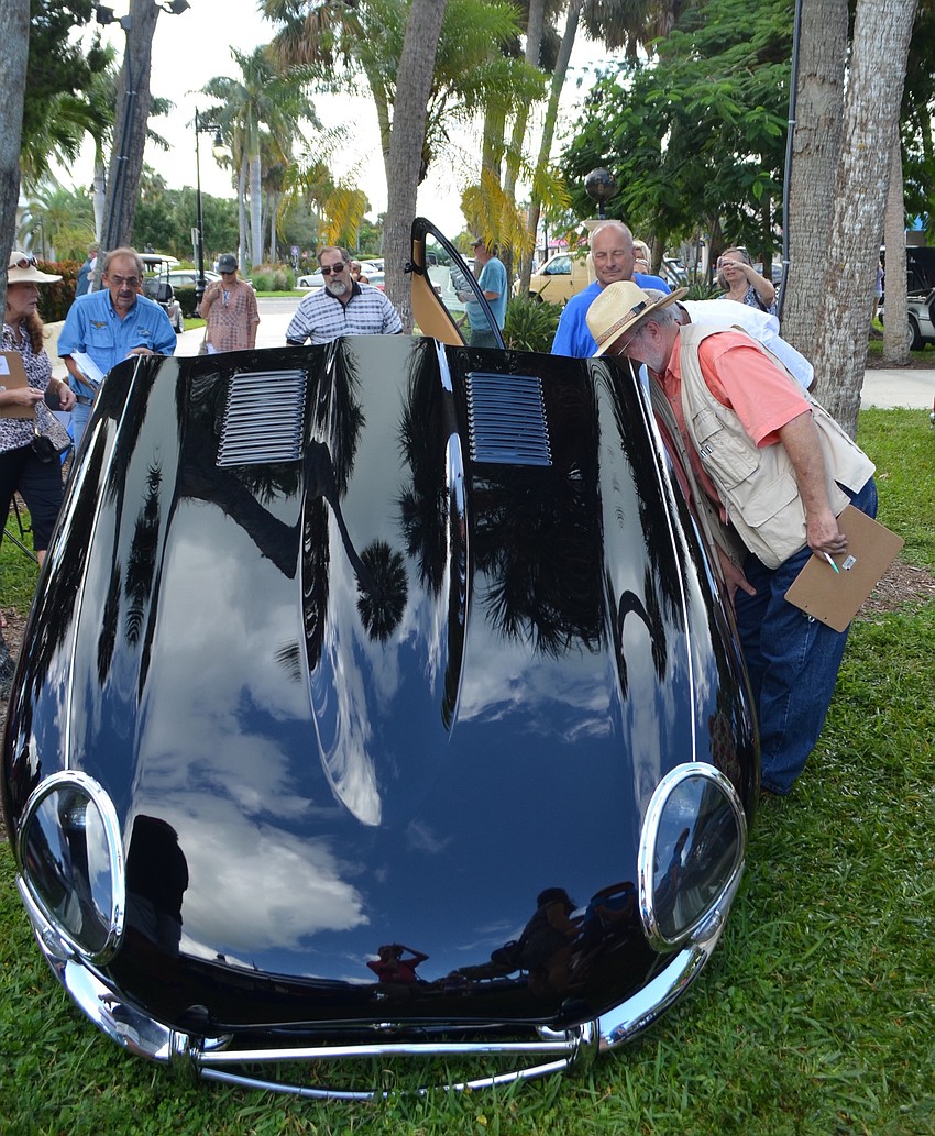 Judges examine Bill Nieland of Panama City Beach's black E-Type.