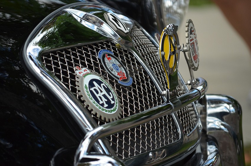 An MGA displays badges on its grill.