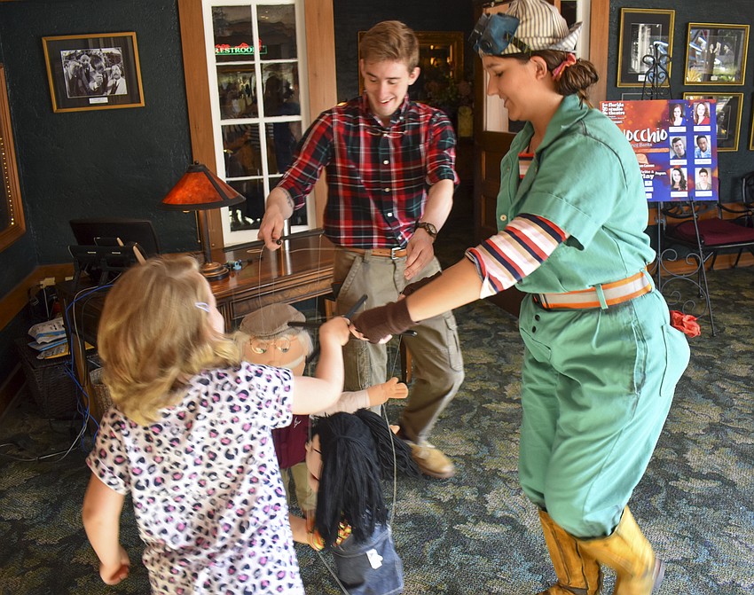 Reilly O'Connell and Will Stapleton play Ring Around the Rosie with Charlotte Allen.