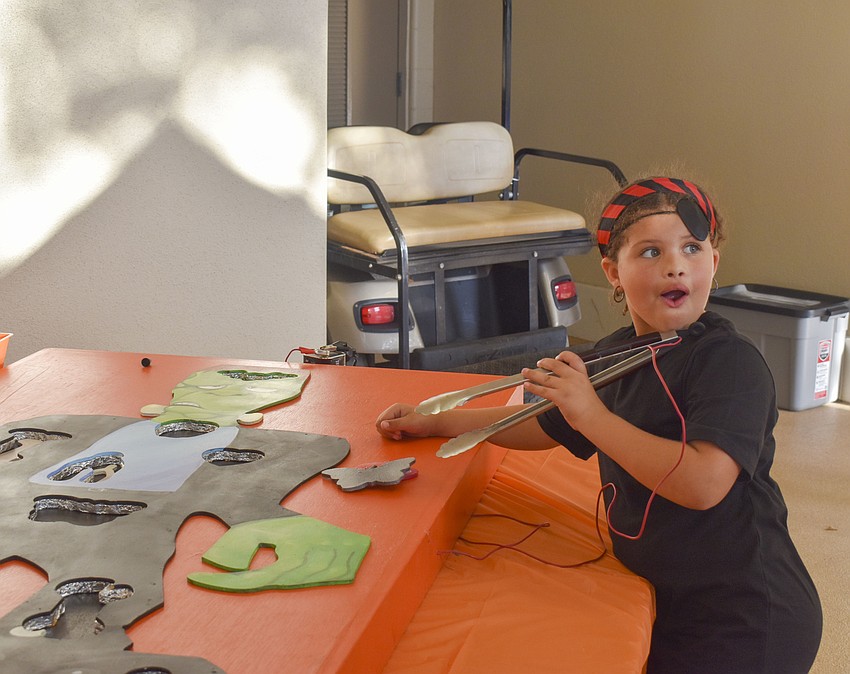 Jazzibella Matos is excited during her game of Frankenstein operation.