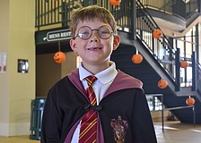 Luke Simmons dresses as Harry Potter.