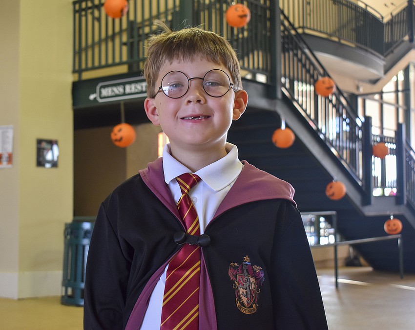 Luke Simmons dresses as Harry Potter.