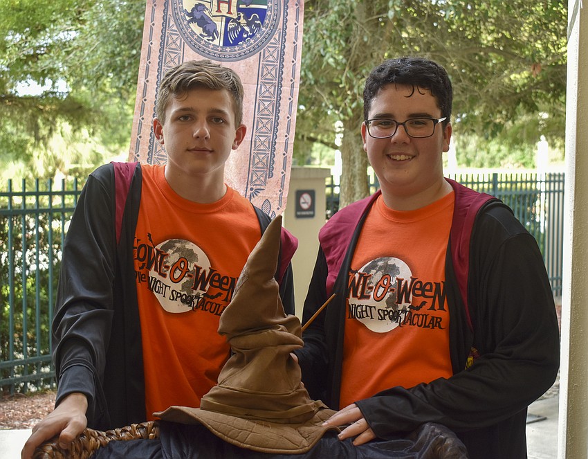 Reed Yingling and Garet Pearson run the sorting hat booth.