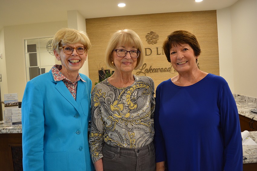 Prospective tenant Roberta Echard chats with Grand Living residents Judy Albert and Marji Tronvold, who both moved in Oct. 1.