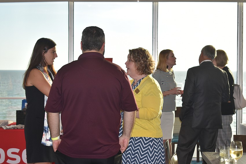 People separated into groups to chat amongst themselves.