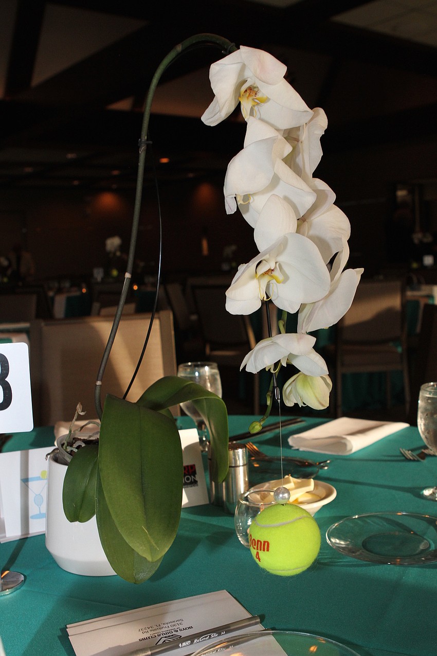 Each of the 26 tables had tennis ball-themed decor.