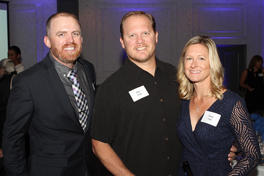 Andrew Pepper with Mike and Mindy Voigt