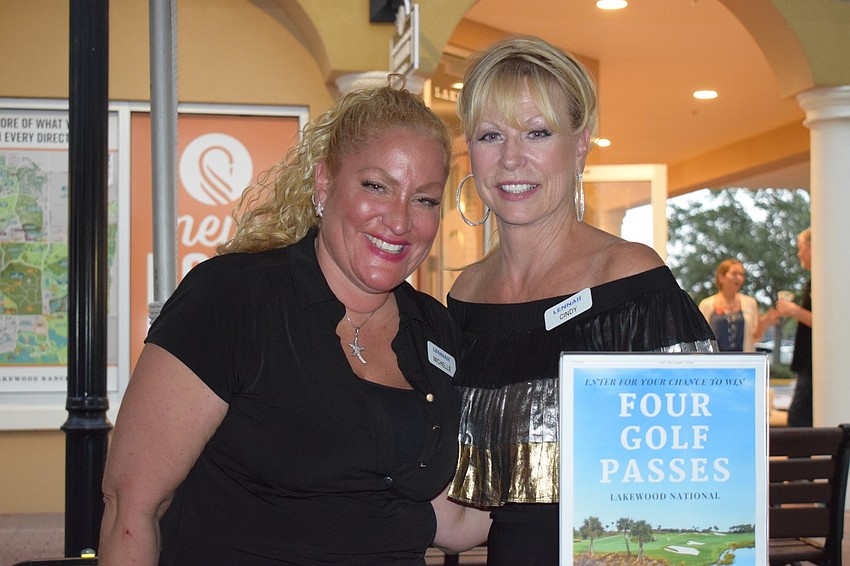 Michelle Tribbi and Cindy Leathwood with Lennar Homes encourage people to enter their raffle for golf passes. Leathwood said she enjoyed meeting and greeting people she hasn't seen in a while as well as new residents.