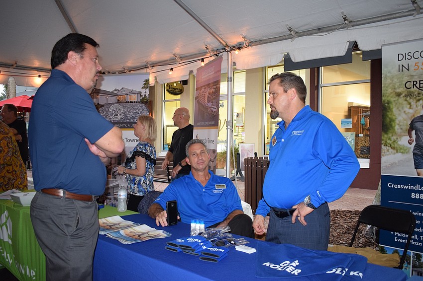 Steve Witmer, with Meritage Homes, talks to Christopher Comeau and Don Mihalik, with Cresswind Lakewood Ranch during the kickoff of Lakewood Ranch's Tour of Homes.