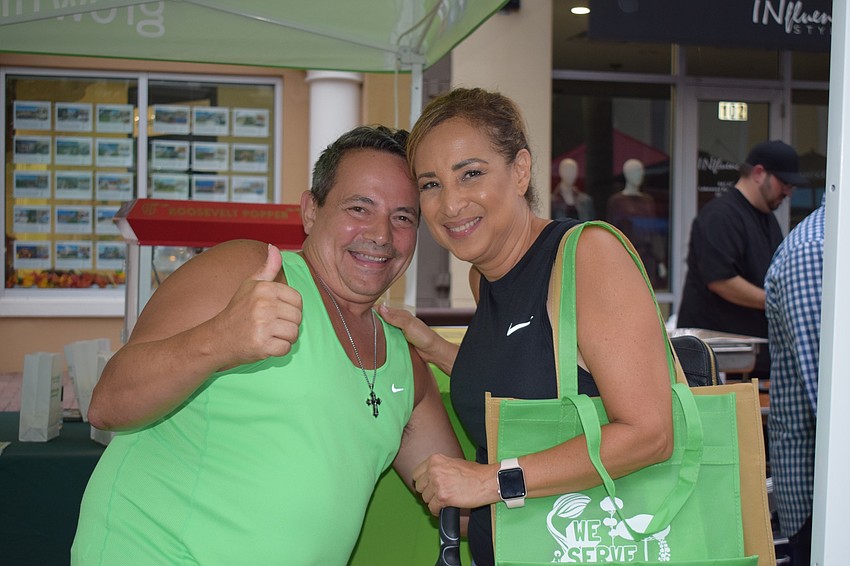 Carlos and Carmen Lebron, of Lakewood Ranch, enjoy the food and entertainment offered at the annual Lakewood Ranch Block Party and Club Day.