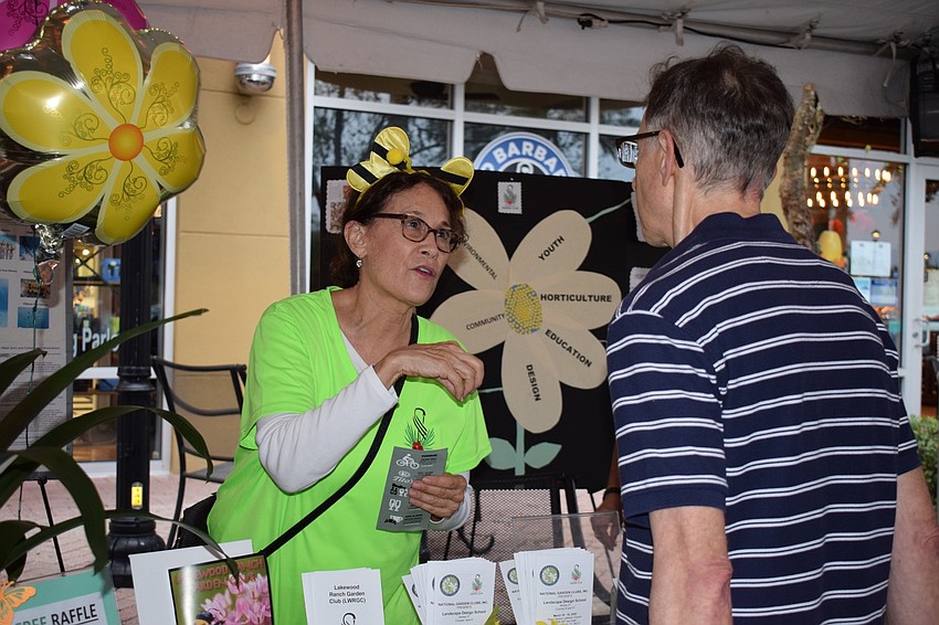 Virginia Craig, head of the awards committee for the Lakewood Ranch Garden Club, talks about the club with Lakewood Ranch resident Barry Lipsitz.