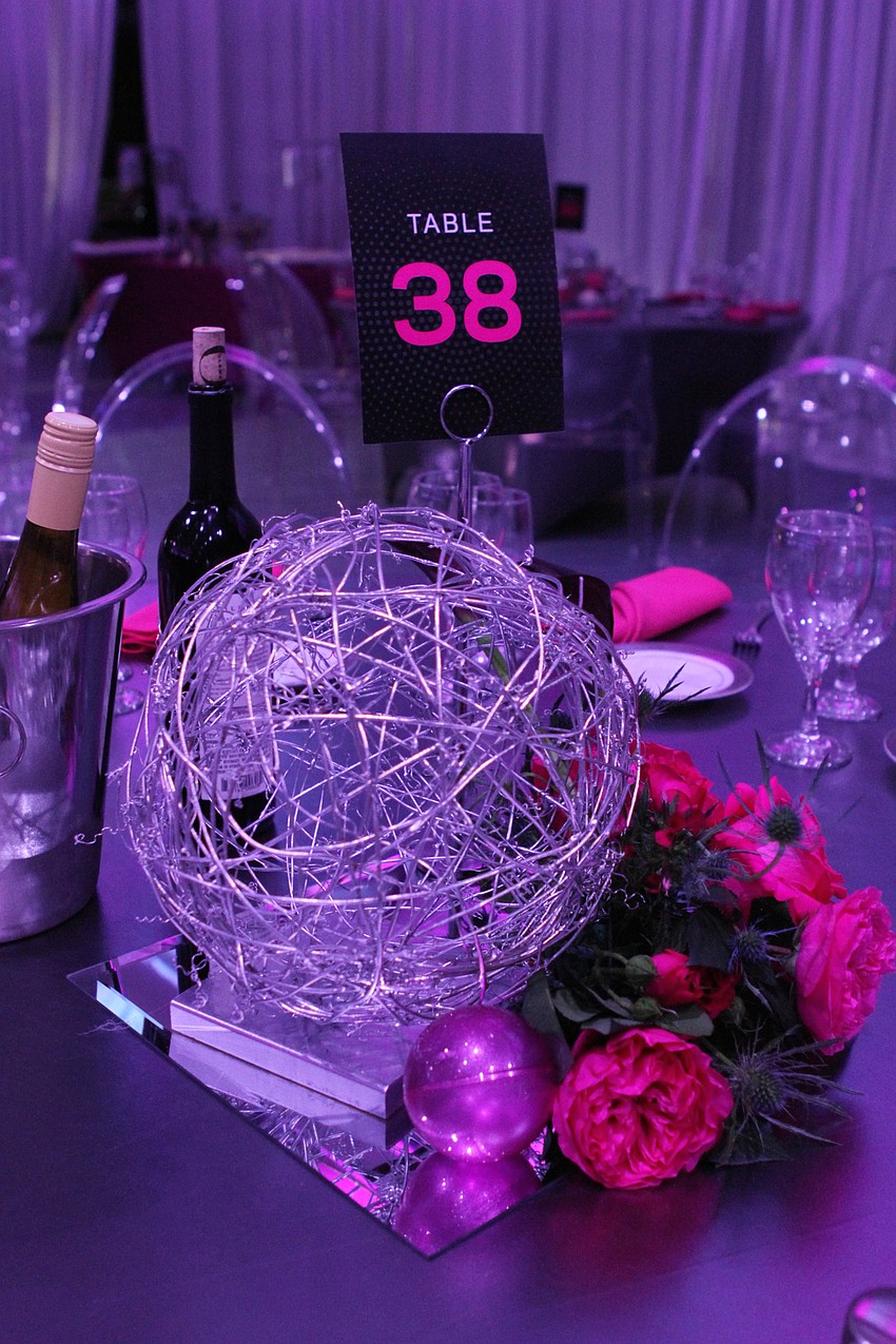 Each table had carefully-set decor by Victoria Blooms.