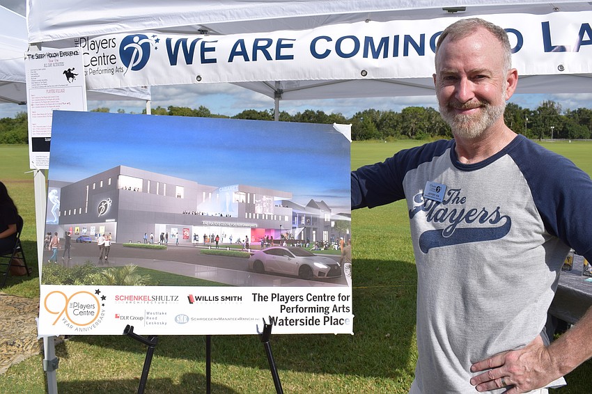 Players Centre Artistic Director Jeffery Kin shows off the newest rendering of the planned new theater in Waterside Place.