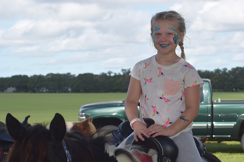 Lakewood Ranch 6-year-old Augusta Rasmussen rides high on a pony before going to see The Legend of Sleepy Hollow.