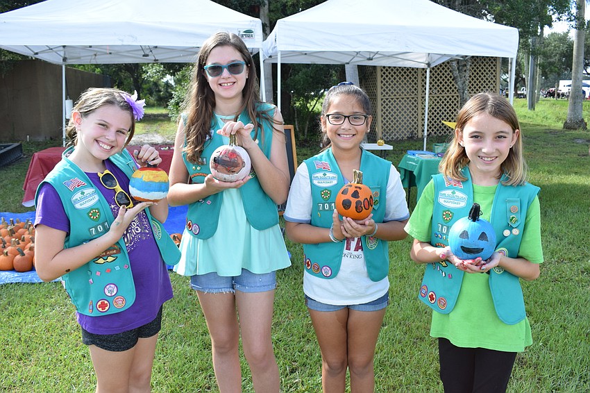 Myakka City's Alice Barr and Lakewood Ranch's Riley Duncan, Gabriela Zevallos and Reese Gurski ran the paint a pumpkin booth. The four 10-year-olds represent Troop 701 out of Braden River Elementary School.