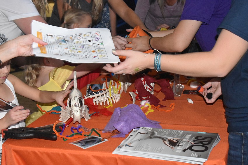Mote employees running the games gave scavenger hunt sheet stamps.