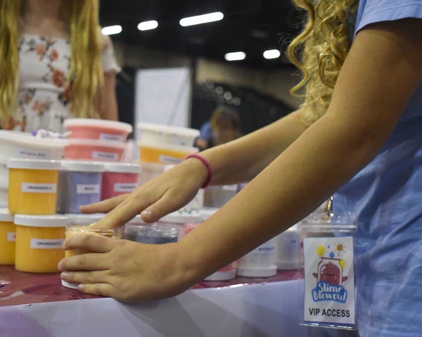 One of the patrons tests slime from Sunrise Slime.