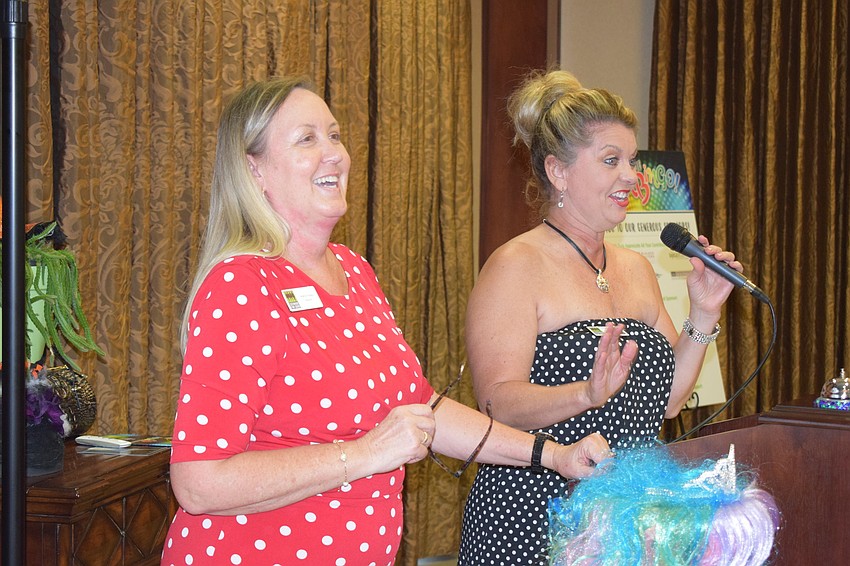 Kathy Fraley and Peggy Kronus of Sisterhood for Good warm up the crowd before the games.