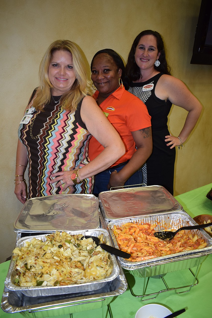 Jason Deli's Diana Willis, Yolanda Charles and Nicole Nunez fed the crowd. Willis, the owner, donated the food for the fundraiser.