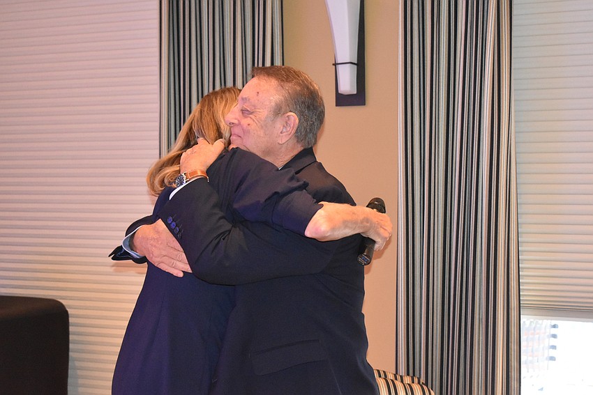 Nanzy Rozance hugs Rich Kirschner,