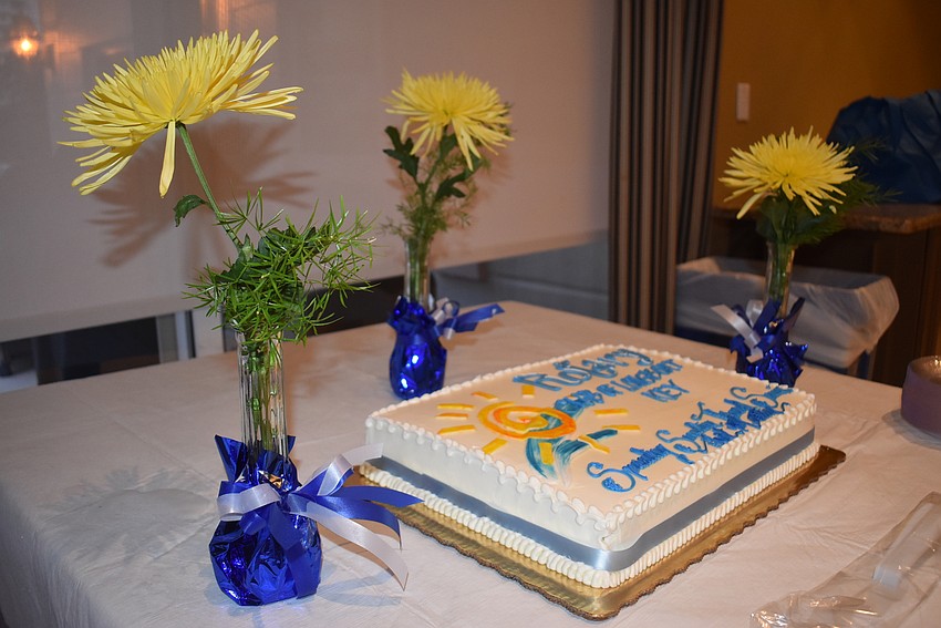 Rotary celebrated with a cake with their motto, 